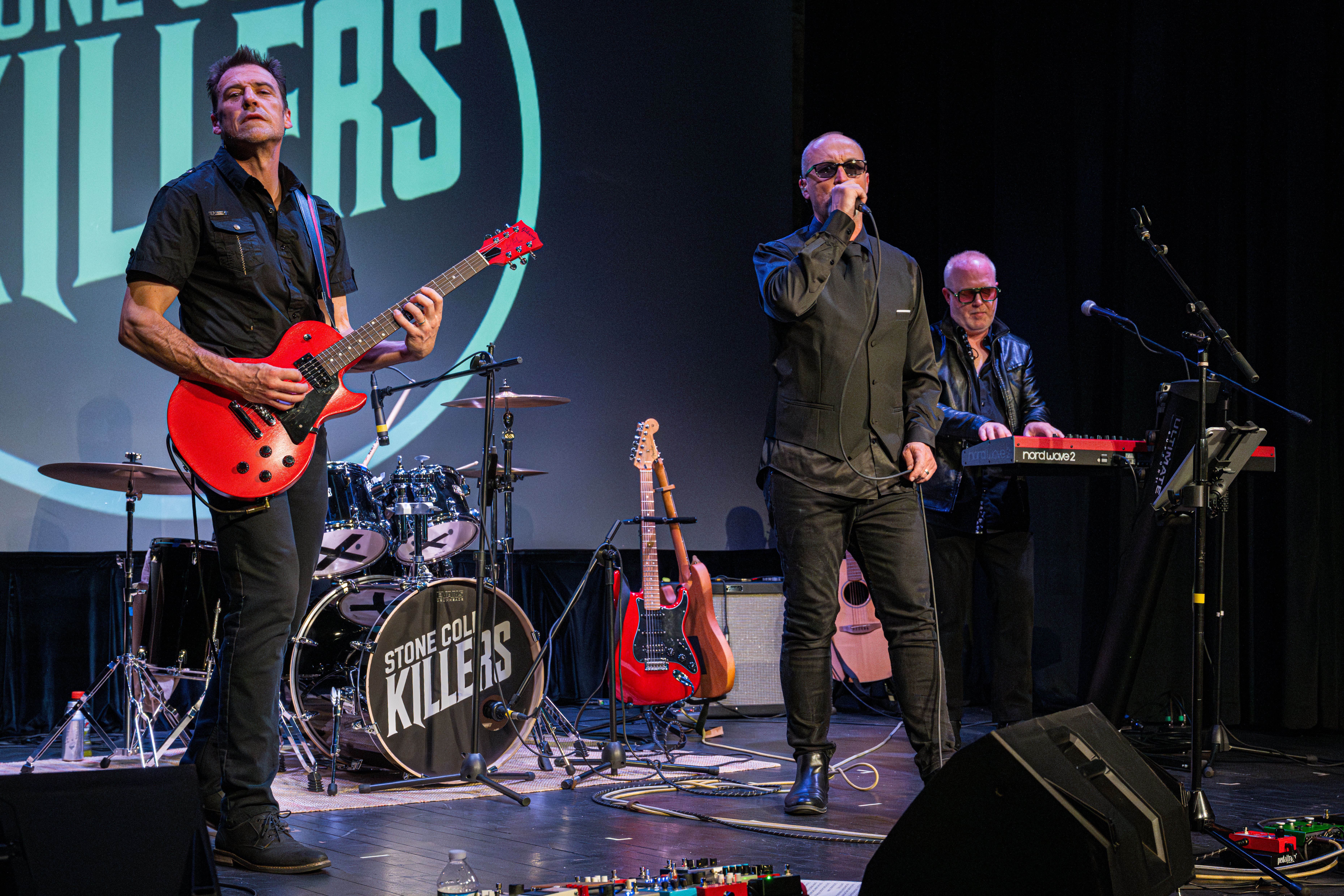 Tom, Carl and Brett on stage